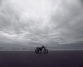 dirt bike in the sea of Ã¢â¬â¹Ã¢â¬â¹cloudy weather Royalty Free Stock Photo